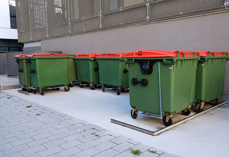 Placing the commercial bins at the designated area after washing, disinfecting and deodorizing them